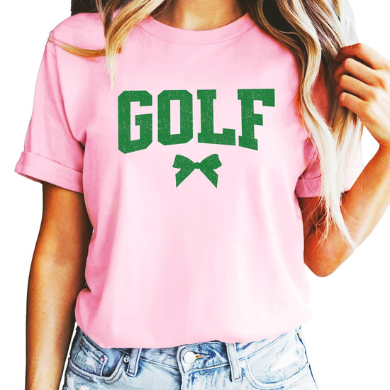 Close-up of distressed bow golf graphic on women's relaxed fit tee