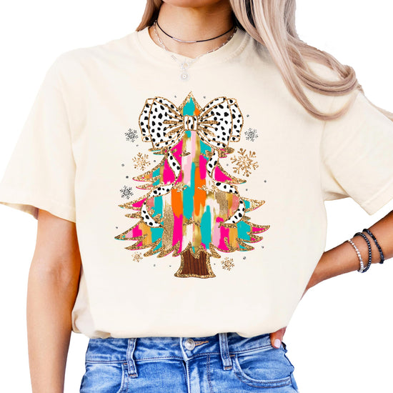 Side or lifestyle view of women's festive coquette Christmas tree graphic tee in seafoam