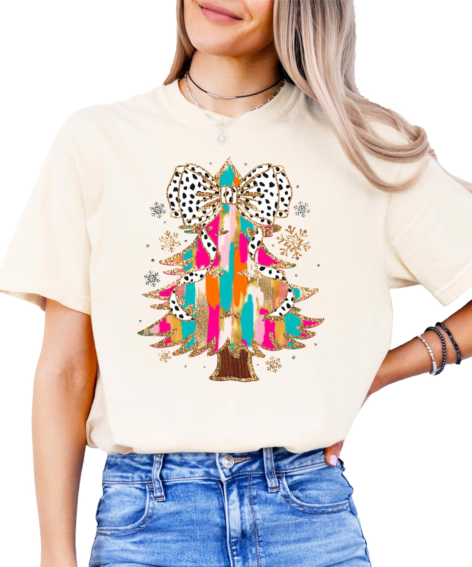 Side or lifestyle view of women's festive coquette Christmas tree graphic tee in seafoam