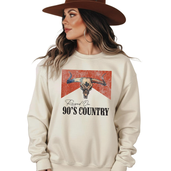 Flat lay of white 90s country music sweatshirt showing complete design details