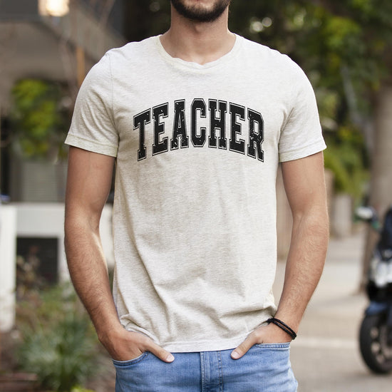Teacher varsity t-shirt styled with jeans showing casual back to school outfit