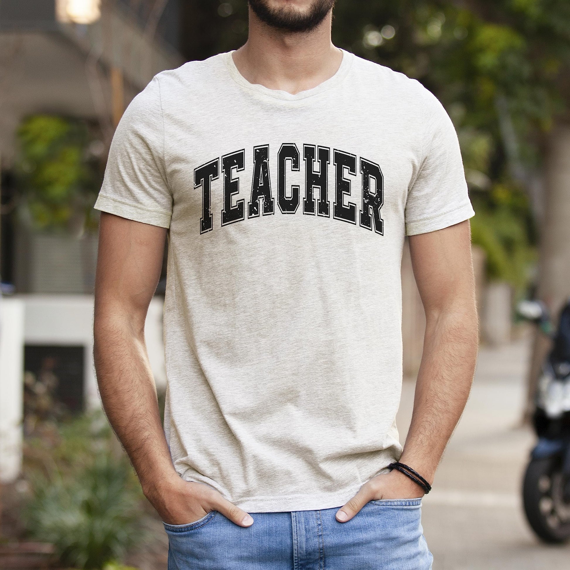 Teacher varsity t-shirt styled with jeans showing casual back to school outfit