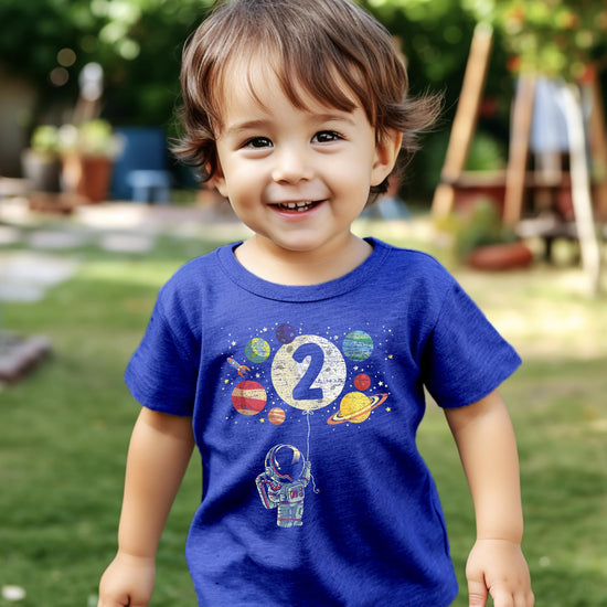 Olive Loves Apple 2nd birthday astronaut shirt detail showing rocket and moon balloon artwork
