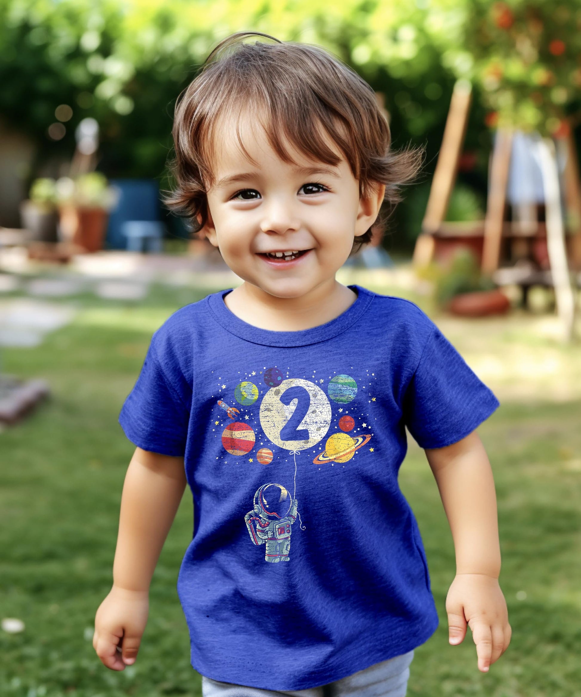Olive Loves Apple 2nd birthday astronaut shirt detail showing rocket and moon balloon artwork
