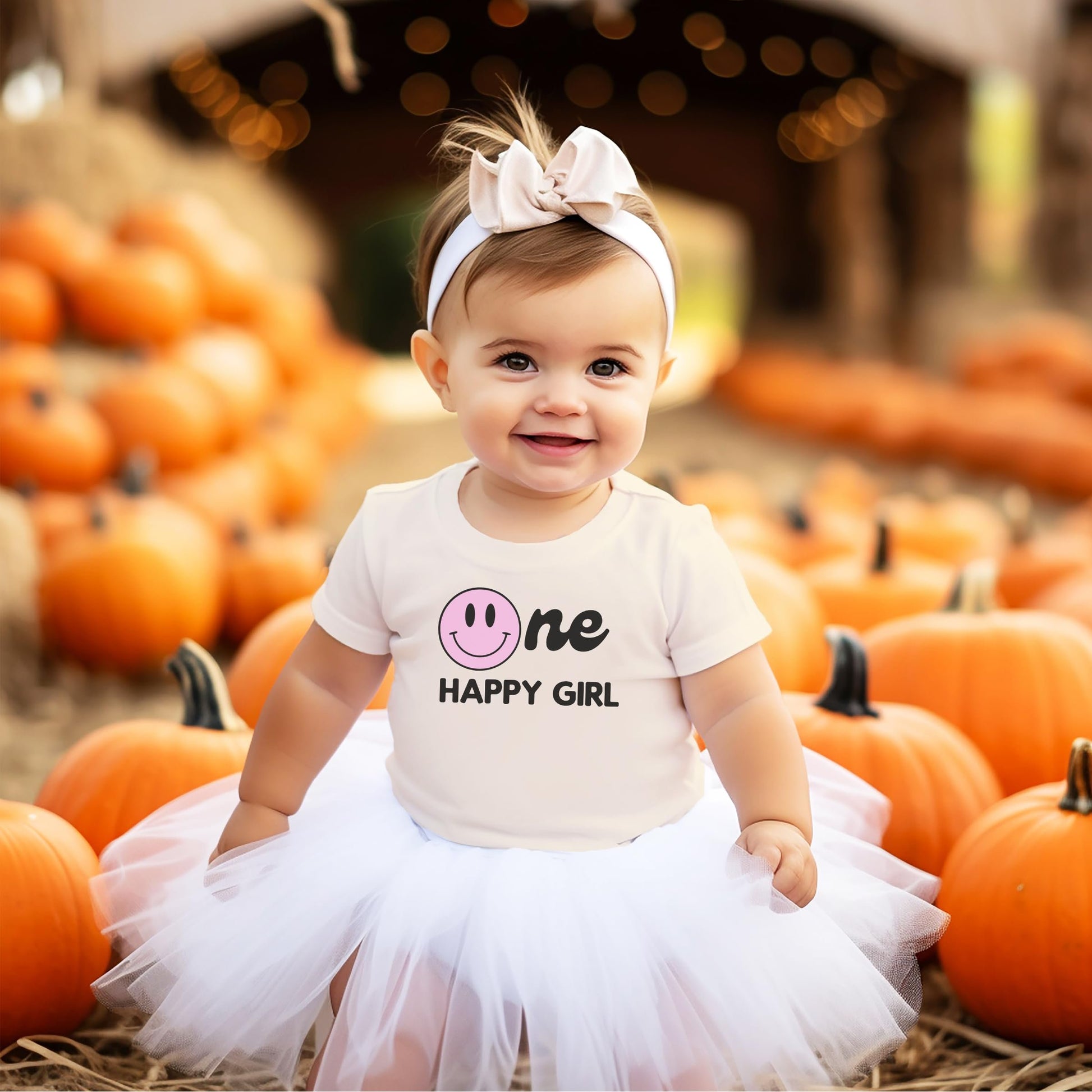 Mom and baby girl wearing matching One Happy Family 1st birthday tees