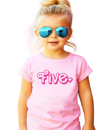 Close-up of pink age five birthday shirt showing heart graphic print detail