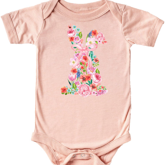 Close-up of watercolor rabbit and floral print on natural white baby bodysuit