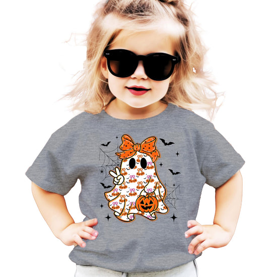Toddler wearing a girly ghost Halloween graphic tee with orange bow detail in natural color