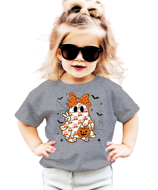 Toddler wearing a girly ghost Halloween graphic tee with orange bow detail in natural color