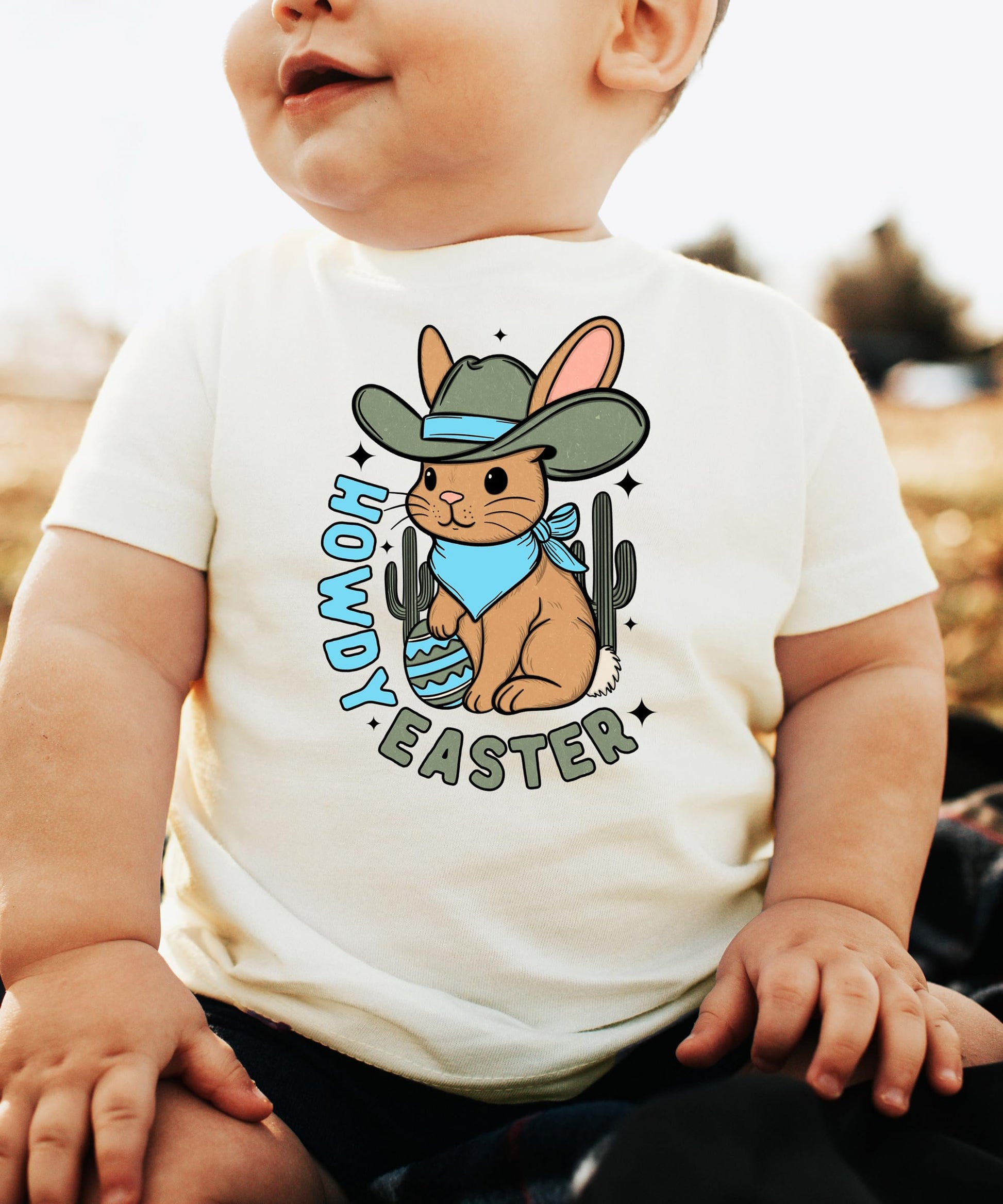 Full front view of boys Howdy Easter graphic shirt with desert bunny and cactus design