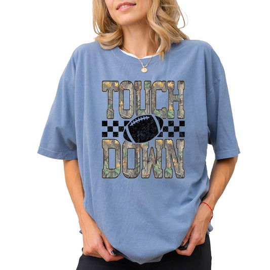 Model wearing camo touchdown football graphic tee styled for game day and tailgating