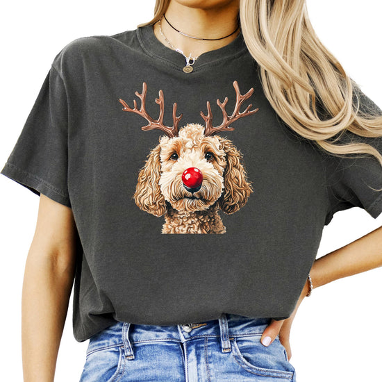 Detail shot of festive doodle dog reindeer design on holiday graphic tee