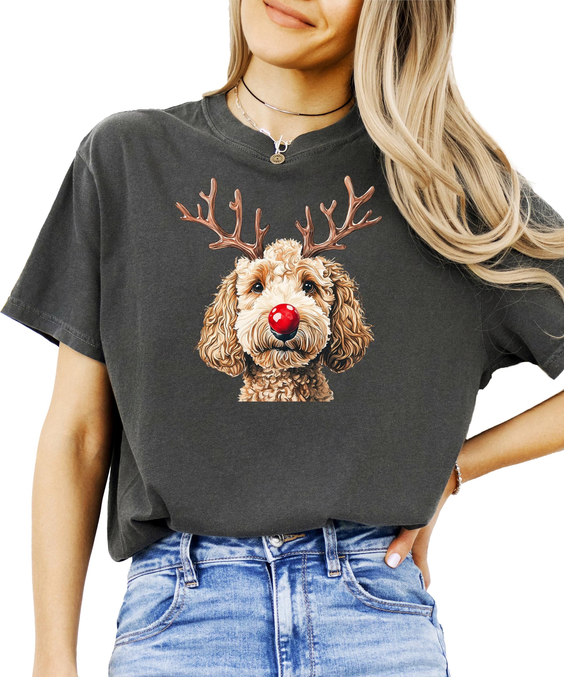 Detail shot of festive doodle dog reindeer design on holiday graphic tee