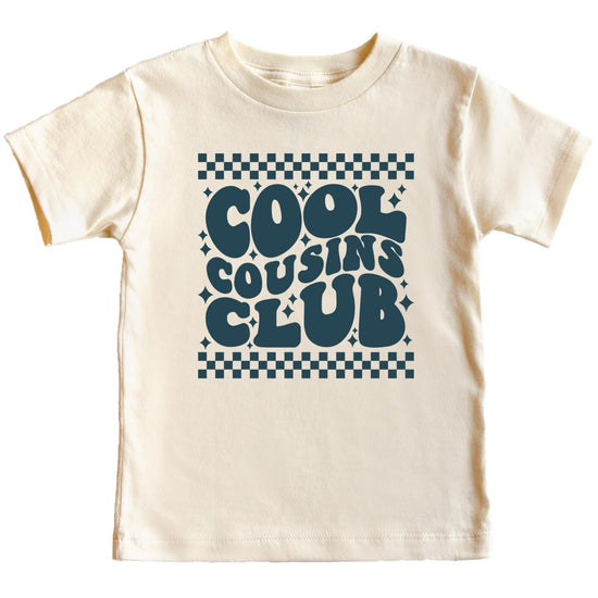 Child wearing peach Cool Cousins Club matching shirt with retro checkered design