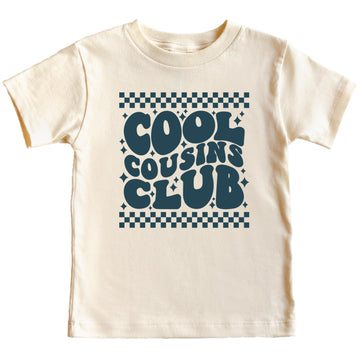 Child wearing peach Cool Cousins Club matching shirt with retro checkered design