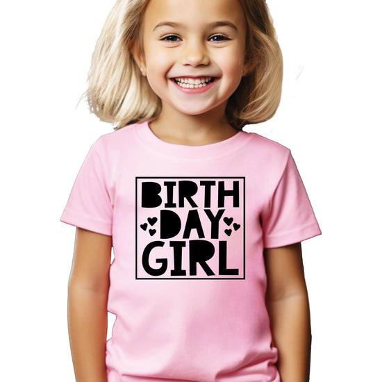 Kids birthday raglan shirt with hearts design laid flat on neutral background
