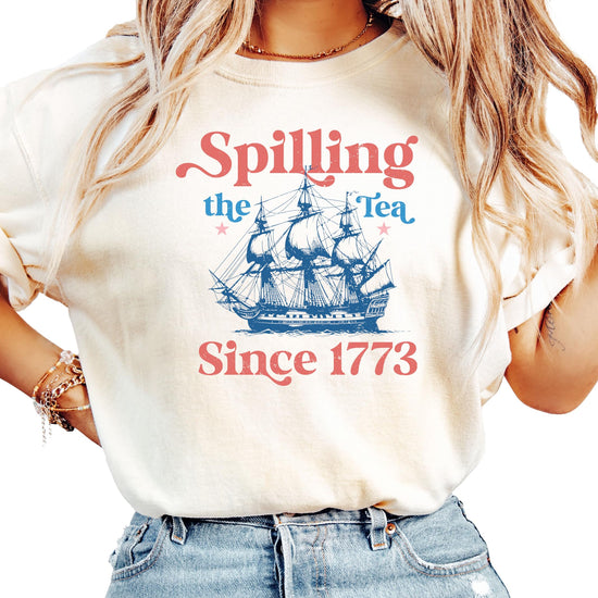 Ivory women's t-shirt with 'Spilling The Tea Since 1773' text design in vintage American style
