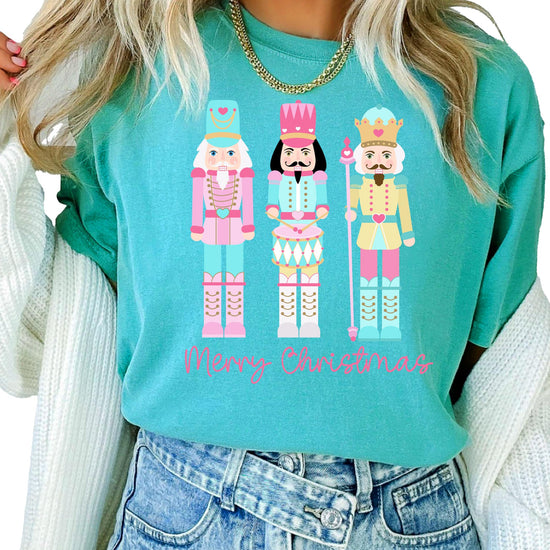 Detail shot of soft fabric and vibrant nutcracker holiday print on women's tee