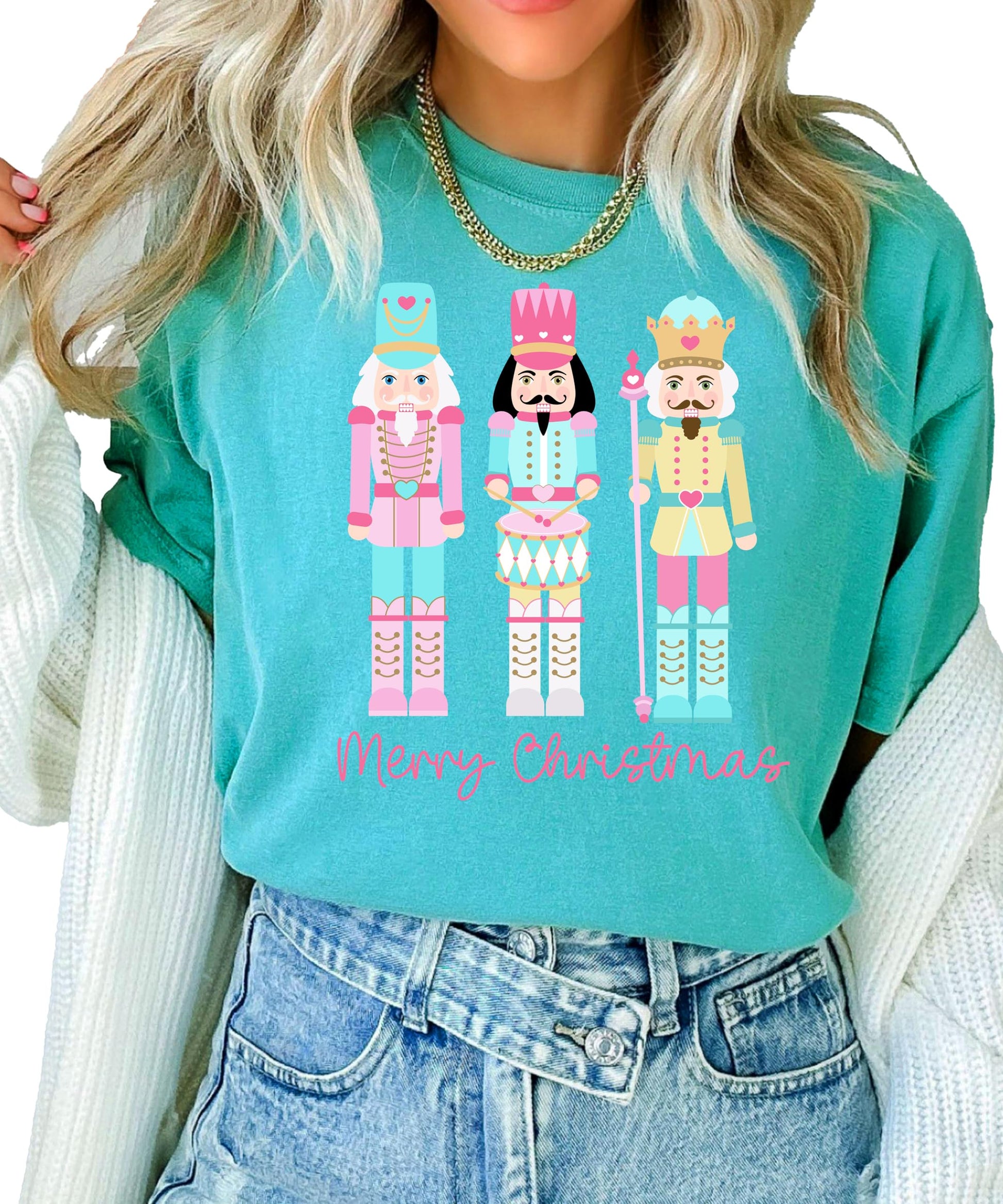 Detail shot of soft fabric and vibrant nutcracker holiday print on women's tee