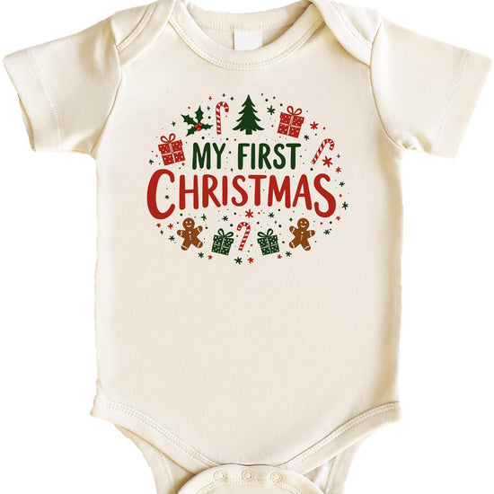 Flat lay of My First Christmas family matching shirts showing newborn and adult sizes
