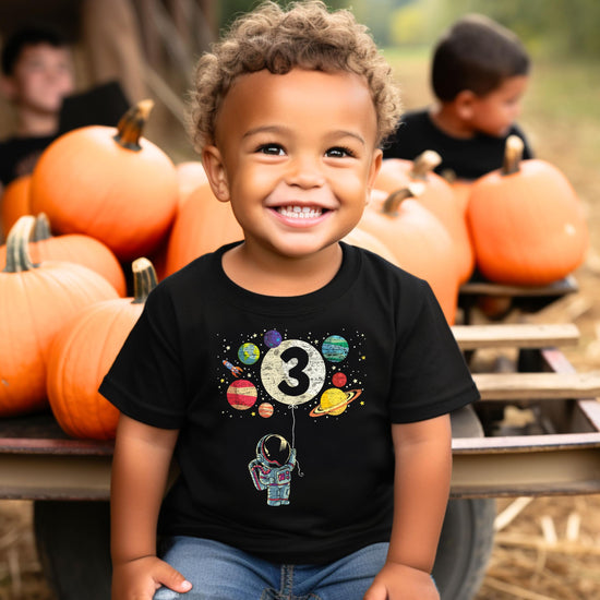 Front view of Olive Loves Apple 3rd birthday astronaut shirt for boys and girls