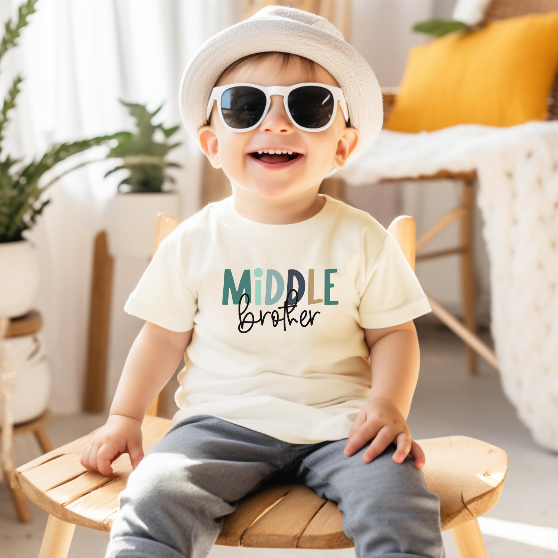 Boys wearing Middle Brother t-shirt styled for a fun sibling reveal or new baby announcement celebration