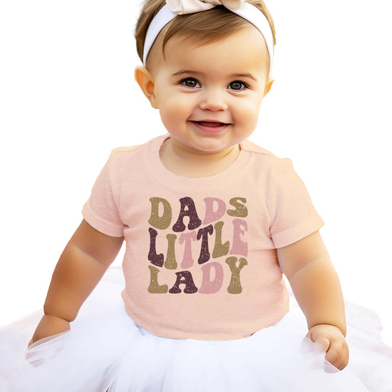 Flat lay of Dad's Little Lady retro graphic tee for girls in natural color