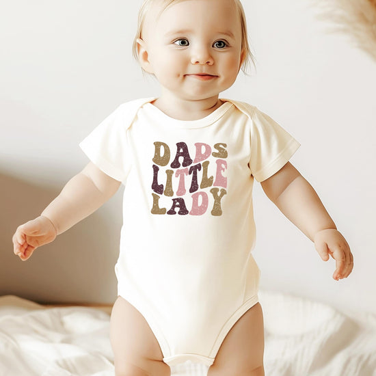 Back view of Dad's Little Lady baby girl one-piece snap bodysuit in peach