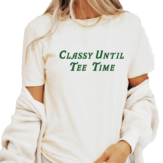 Flat lay of Classy Until Tee Time women's green golf t-shirt showing fit and overall design