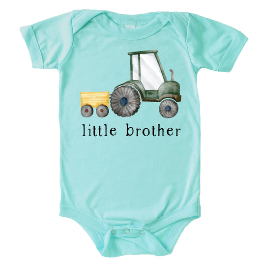 Little brother farm tractor shirt laid flat showing full graphic design on natural fabric