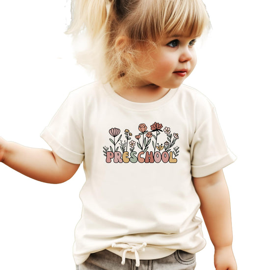 Front view of toddler wildflower boho graphic tee in natural color