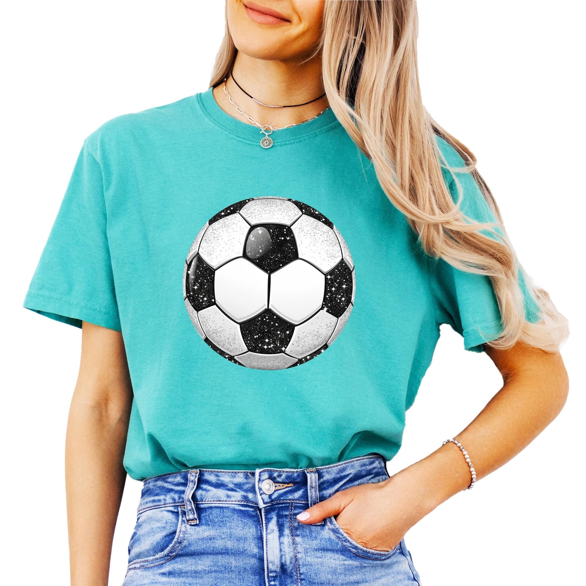 Close-up view of sparkly faux glitter soccer ball graphic on women's tee shirt