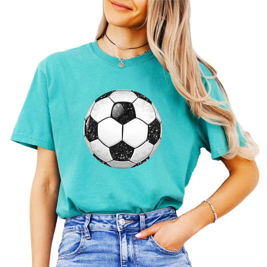 Close-up view of sparkly faux glitter soccer ball graphic on women's tee shirt
