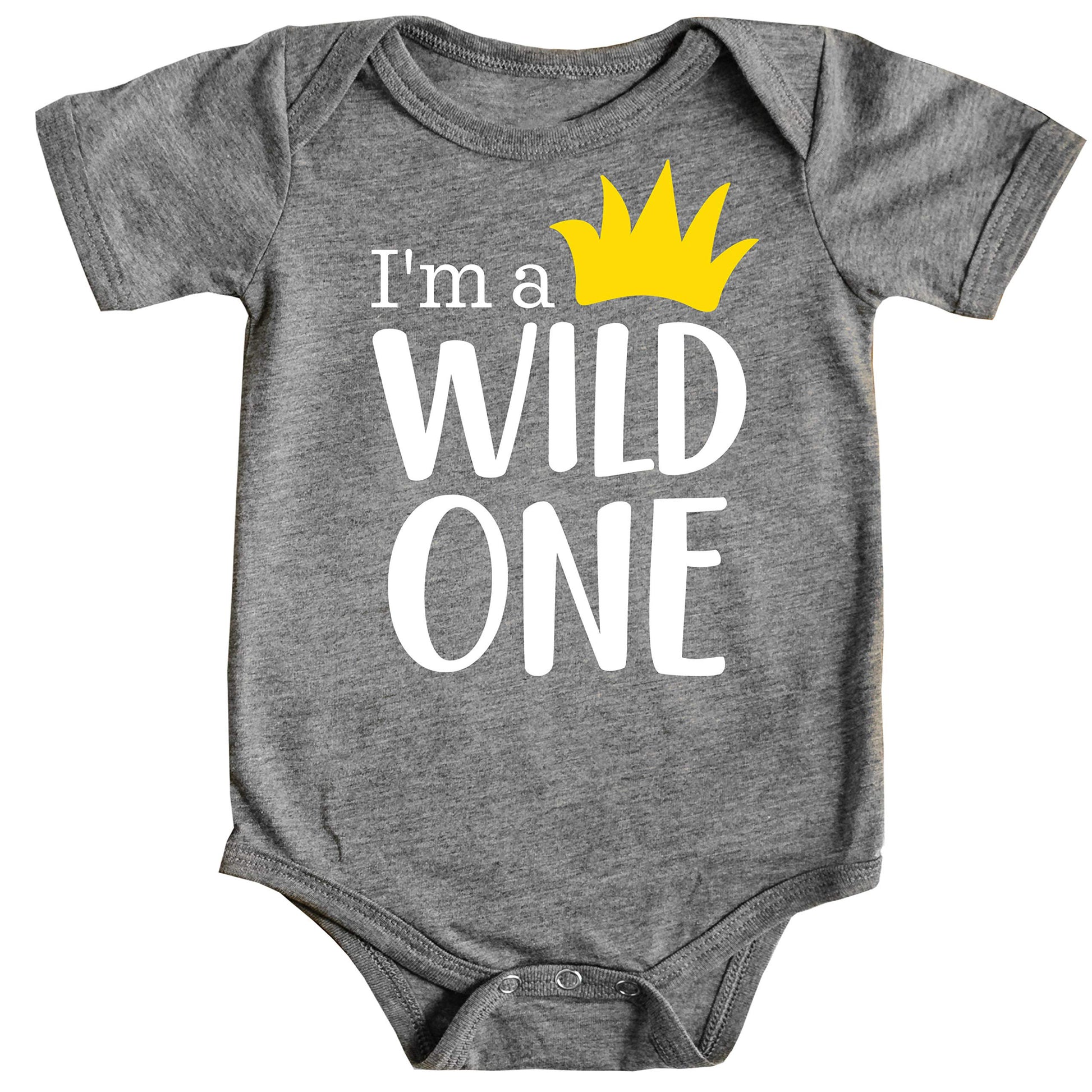 Baby boy wearing a white Wild One first birthday bodysuit with a yellow crown graphic