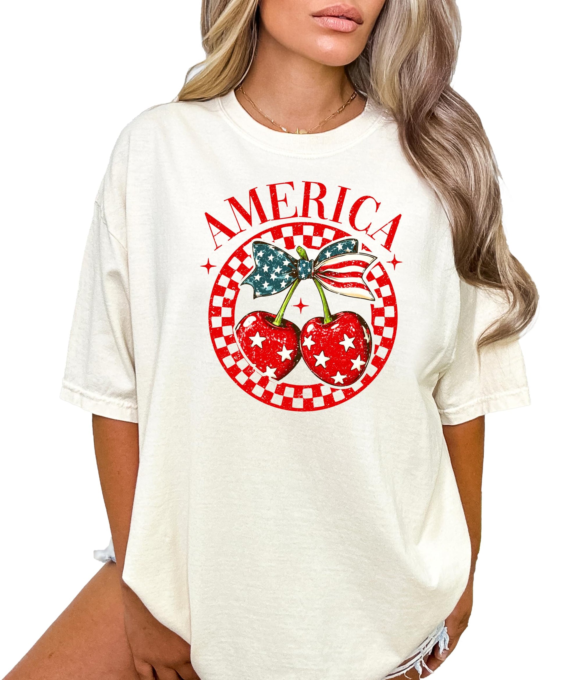 Patriotic cherry bow tee with stars and stripes design on ivory shirt