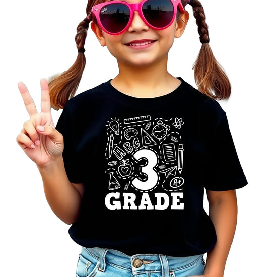 Close-up of third grade graphic print on mauve youth back to school tee