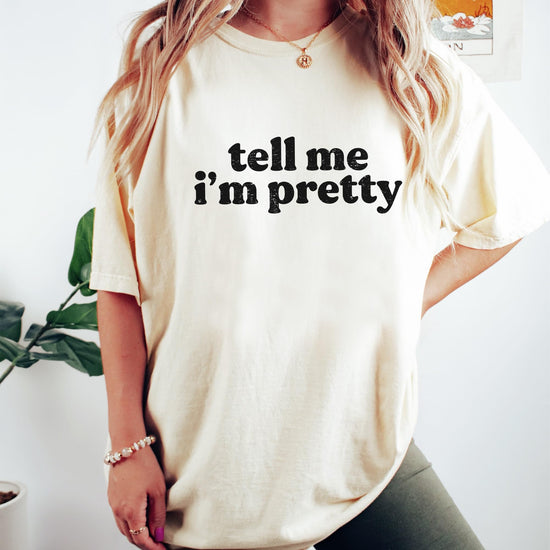 Detail shot of soft fabric and print quality on Tell Me I'm Pretty women's tee