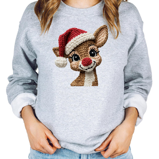 Full-length view of adult wearing a white Christmas reindeer graphic sweatshirt