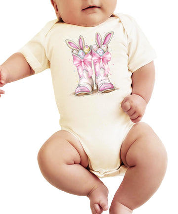 Close-up of Easter cowboy boots and pastel eggs graphic on soft baby girl bodysuit
