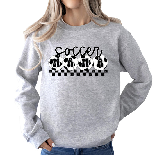 Close-up of Soccer Mama checkered print graphic on red women's sweatshirt