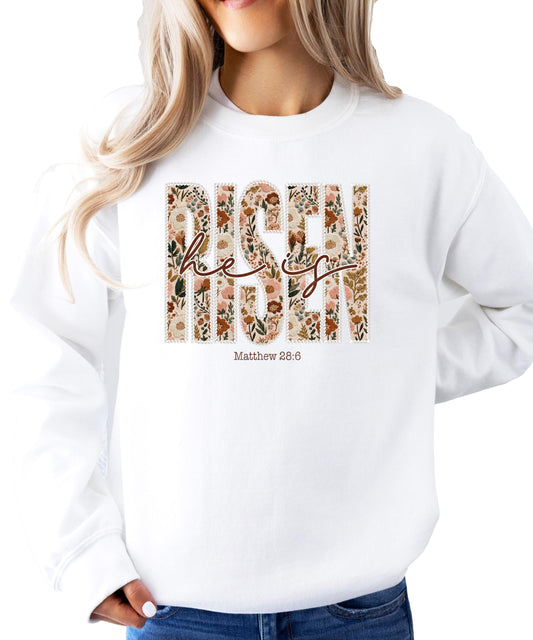 Lifestyle photo of woman wearing He Is Risen floral Christian sweatshirt in army green