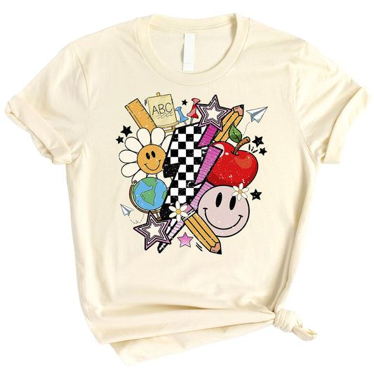 Close-up of groovy teacher life graphic print on a soft peach women's shirt