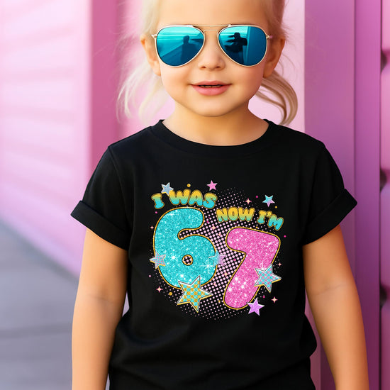 Girl wearing pink '7th birthday' glitter graphic tee, full body view