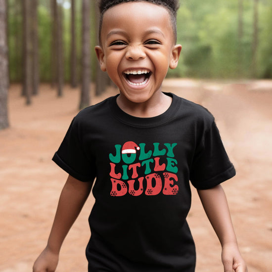 Detail shot of Jolly Little Dude holiday graphic tee print quality on black kids shirt