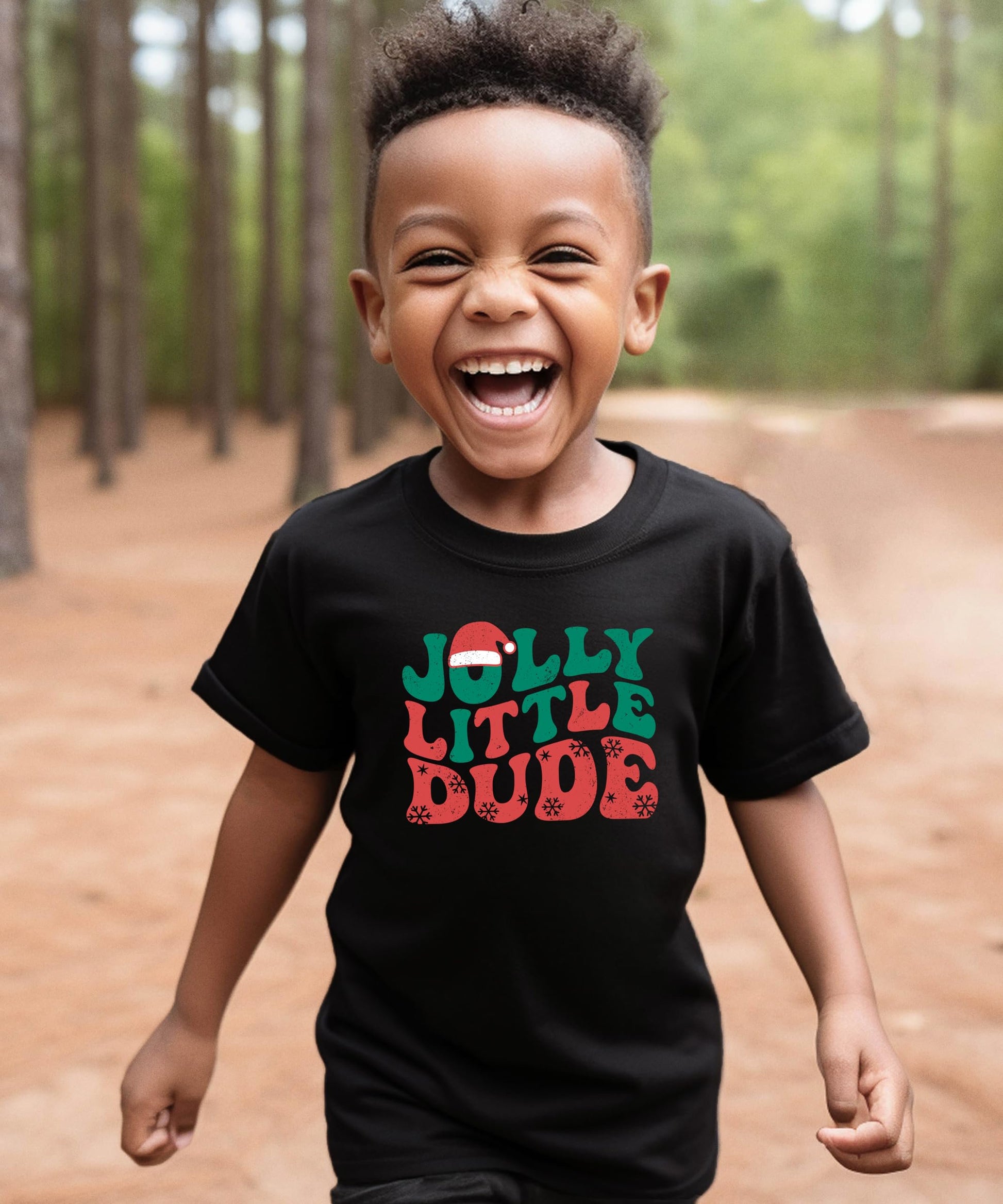 Detail shot of Jolly Little Dude holiday graphic tee print quality on black kids shirt