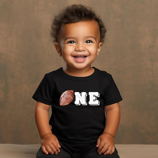 Detail shot of distressed football outline graphic on boys 1st birthday tee
