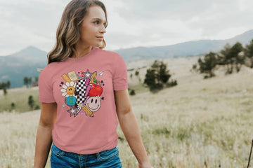 Women's peach groovy educator shirt styled for back to school season