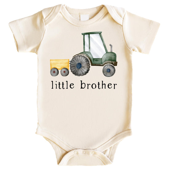 Toddler boy wearing little brother farm tractor tee for sibling reveal photo