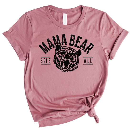 Mama Bear Sees All graphic tee in black print on peach shirt, front view