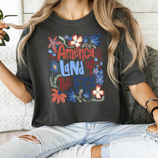 Detail shot of red white and blue floral design on patriotic women's graphic tee